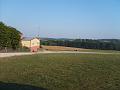 Looking from end of paved lot over Carnivals Grounds Fields SE